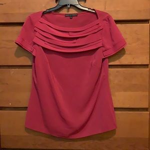 Isabella De Marco pink shirt sleeved blouse with stacked pleated detail at neck.